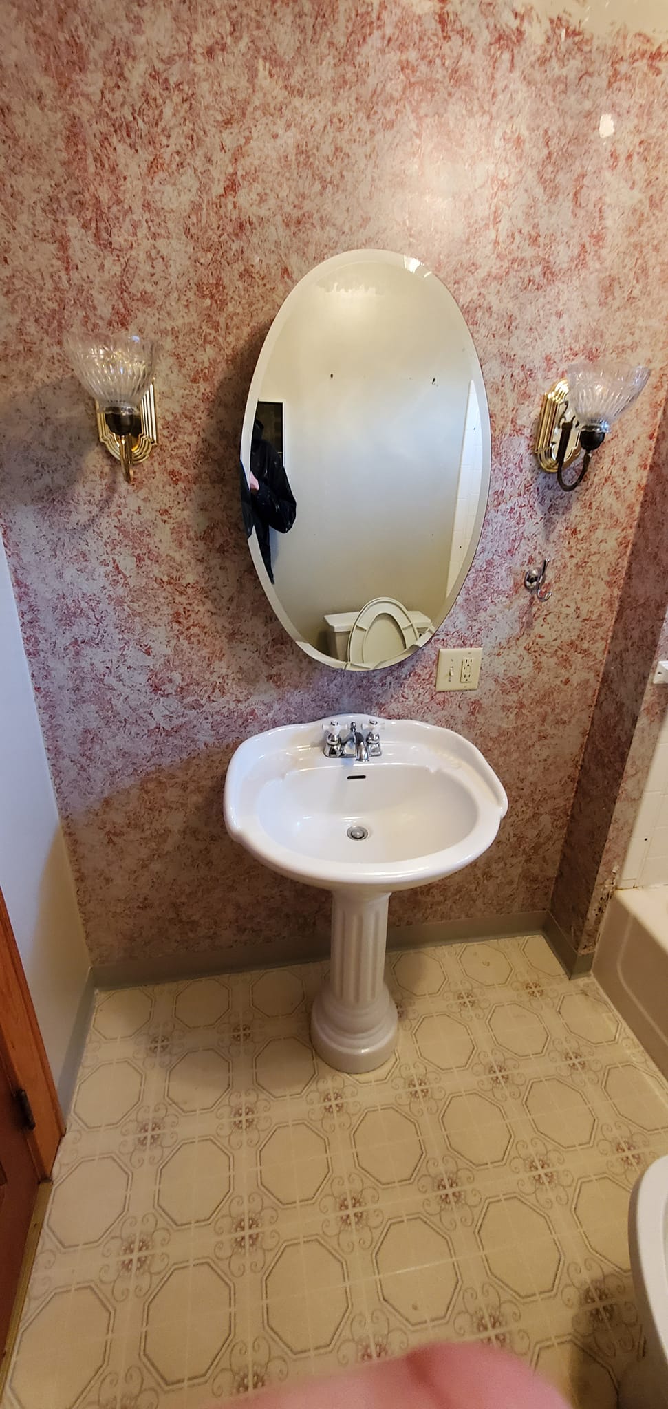 Bathroom sink and mirror after remodel