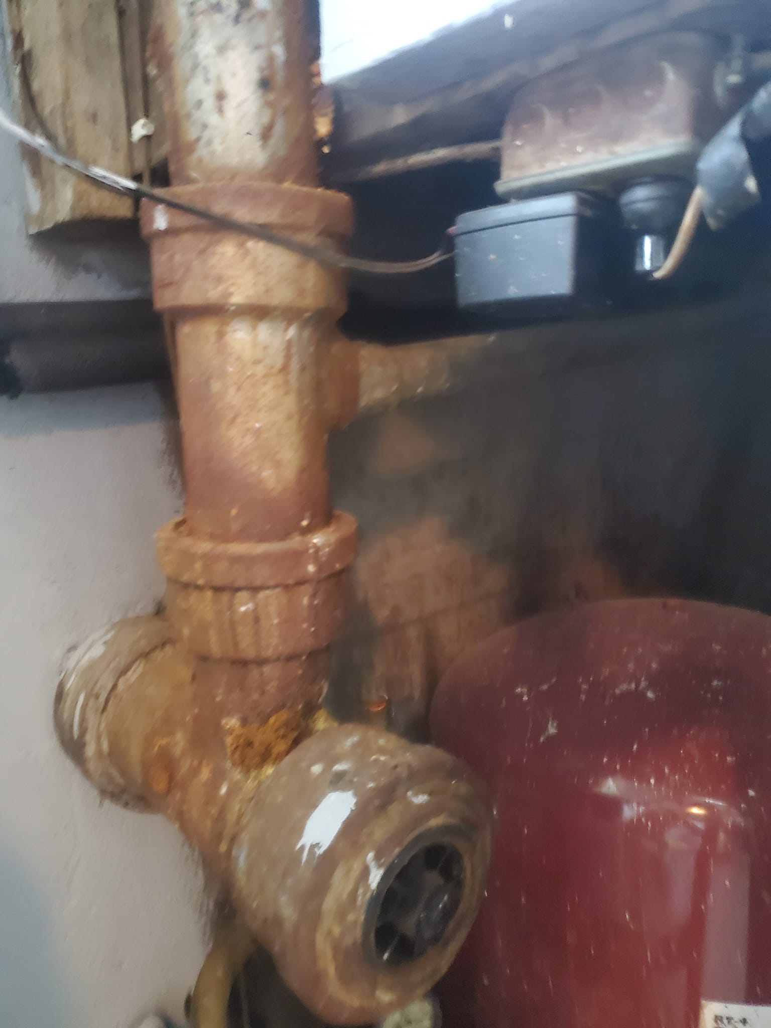 Leaking water heater plumbing before repair